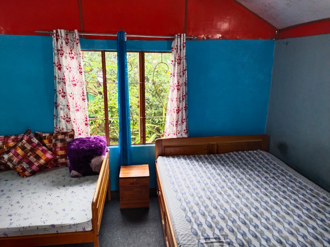 Cozy Sittong homestay room: Warm tones, soft lighting, and a serene ambiance with mountain views.